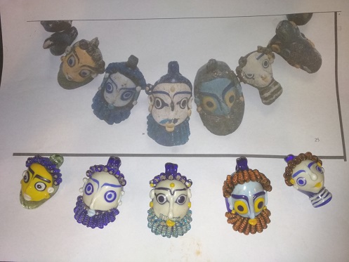 Karthagische Maskenperlen einer Kette aus Olbia, Italien/Sardinien